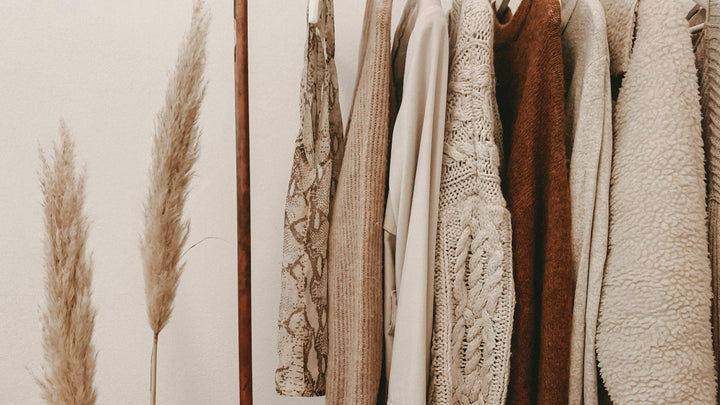 Clothing in a softly lit wardrobe